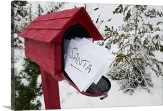 a red mailbox with a sign that says santa written on it