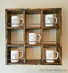 two mugs are sitting in a wooden box with mr and mrs written on them