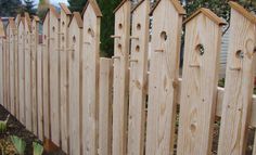 a wooden fence that has holes in it