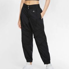 Nwt Plus Size Xxl Jordan Woven Wind Pants. Material Has Swishy/Parachute Feel And Is Very Light Weight. It Has 2 Front Waist Pockets, 2 Front Velcro Cargo Pockets And 2 Back Velcro Cargo Pockets, 1 Back Zip Pocket, Cuffs At Hem, And Belt Loops. Style Is Standard Fit. It Is Unlined. Inseam Approx 28.25" Nike Wind Pants, Nike Jordans Women, Red Joggers, Scrubs Outfit, Jordans Women, Pantsuits For Women, Classic Pants, Womens Jordans, Utility Pants