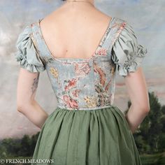 This blue floral corset is as delicately lovely as it is durable and supportive. The antique light blue fabric looks as if it's been painted on, and will fit right in with pastoral backdrops of the 18th century, or among the fair folk of your local Renaissance festival. Its light boning and strong cotton canvas lining ensures unparalleled support and stability as you traverse the great outdoors, while the lacing at the front allows you to adjust the fit to your liking. You'll feel comfortable an Fair Folk, Parisian Blue, Light Blue Fabric, Floral Corset, Antique Lighting, Fabric Swatches, Different Fabrics, Blue Fabric, Cotton Weaving