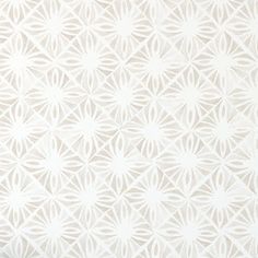 a white wallpaper with an intricate design on it