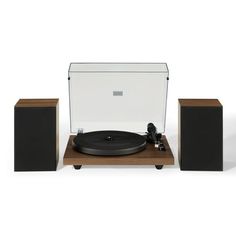 a record player and speakers on a white background