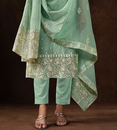 COLOR : Mint Green FABRIC : Top - Soft Organza, Bottom - Dull Santoon, Dupatta - Soft Organza WORK : Heavy Resham Embroidery, Zari, Sequins, Lace BorderOCCASION : Engagement, Party Wear, Festival READY-TO-WEAR : No STITCHING : Available as semi-stitched fabric, can be stitched using standard size option (+$20). Note: There might be a slight color variation due to lighting and flash used during photoshoot. The bright shade seen is the best closer view of fabric's color. Traditional Churidar With Floral Embroidery For Reception, Reception Churidar With Floral Embroidery, Unstitched Churidar With Floral Embroidery For Reception, Elegant Floral Embroidered Churidar For Weddings, Pista Green Chikankari Embroidery Set For Reception, Pista Green Chikankari Sets For Reception, Semi-stitched Floral Embroidered Churidar For Reception, Festive Unstitched Suit With Floral Embroidery For Reception, Embroidered Straight Kurta Set For Reception