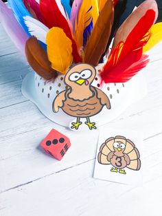 a turkey hat filled with feathers and dices