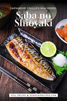 Japanese grilled mackerel served with a lime half and grated daikon on a shiso leaf on a black rectangular plate on a dark wooden table Mackerel Fillet Recipes, Saba Recipe, Mackerel Recipe, Grilled Mackerel, Mackerel Recipes, Global Cuisine, Ethnic Food