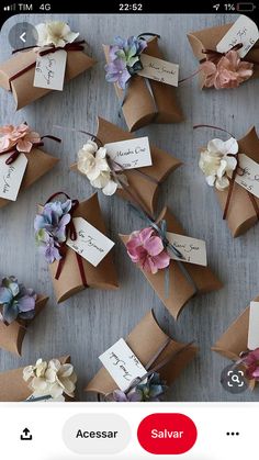 many small flowers are placed on top of each other with name tags attached to them