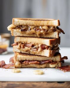 bacon and cheese sandwich stacked on top of each other with peanut butter in the middle