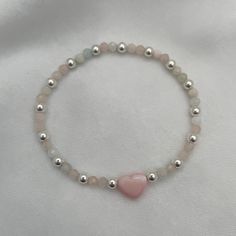 Introducing our Blush Heart and Gemstone Bead Bracelet in radiant sterling silver—a true embodiment of joy and elegance! With its delicate blush heart charm and shimmering gemstone beads, this bracelet is a celebration of love and individuality. Each bead tells a story, reflecting the wearer's unique journey and personality. Whether you're adding a pop of color to your everyday look or stacking it with other treasures, this bracelet is sure to spark joy and conversation wherever you go. Embrace Puffy Heart Charms, Spark Joy, Gemstone Beaded Bracelets, Puffy Heart, Pink Bracelet, Matching Bracelets, Pink Opal, Initial Charm, Personalized Necklace