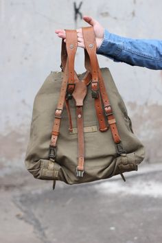 Vintage Leather Backpack With Adjustable Strap For Adventure, Vintage Waxed Finish Backpack For Adventure, Vintage Adventure Backpack With Waxed Finish, Military Style Backpack For Adventure, Canvas Leather Bag, Military Style Outdoor Bag With Adjustable Strap