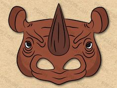 an animal mask with horns and ears on it's face, in brown paper