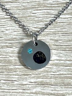 "Custom necklace engraved with your very own embryo! 13mm stainless steel pendant with blue stone on a dainty 18\" chain. Lobster claw clasp for easy closure. Hypoallergenic, tarnish and rust-proof. Select gift certificate to pre-order this item if you would like to send as a gift but are missing the photo or other details. You will receive a gift certificate via email that can be redeemed by you or another at a later date! Free shipping now or later! Commemorate a transfer or celebrate a new pr Stainless Steel Charm Necklace With Round Pendant, Stainless Steel Round Pendant Charm Necklace, Hypoallergenic Stainless Steel Round Pendant Jewelry, Cadmium-free Round Stainless Steel Necklace, Stainless Steel Round Pendant Necklace Cadmium-free, Hypoallergenic Stainless Steel Round Necklace, Hypoallergenic Stainless Steel Pendant Charm Necklace, Silver Round Birthstone Necklace For Keepsake, Silver Round Birthstone Necklace Keepsake