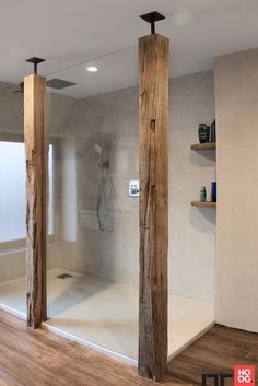 an image of a bathroom setting with wood columns