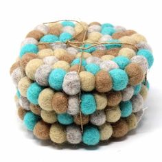 a pile of multicolored wool balls tied together