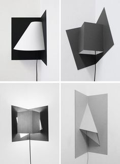 four different angles of an open book with paper cut out and attached to the wall