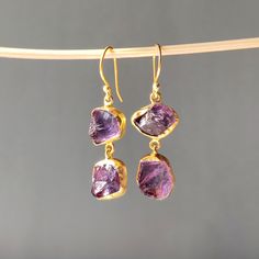 "PRODUCT DESCRIPTION  Specifications: Amethyst Handmade Earrings Brass Gold Plated Dangle Drop Earrings Jewelry Christmas Gift for her Jewelry Type: Gemstone Earring   Plating : 18K Gold Plated  WEIGHT: Earring Weight : 8.57Grms SIZE: Jewelry Size:1.96*0.51\" Item Code: E/TJBE/0060A" Purple Long Drop Earrings As Gift, Gold Amethyst Earrings For Parties, Party Amethyst Drop Earrings, Party Drop Earrings With Amethyst, Purple Drop Crystal Earrings As Gift, Purple Crystal Drop Earrings For Gift, Purple Drop Crystal Earrings For Gifting, Purple Crystal Earrings Gift, Purple Crystal Earrings Matching Set For Gift