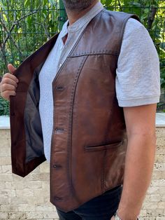 It is made of very useful and soft sheep and lamb leather. There are 2 pockets and button details on the product. Made of 100% leather. The right choice for a special day gift to your loved ones. Mens Western Vest, Mens Leather Waistcoat, Brown Leather Vest, Mens Vest Casual, Celtic Dress, Leather Tanning, Vintage Western Wear, Western Vest, Steampunk Leather