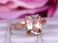 an engagement ring with a cushion cut morganite