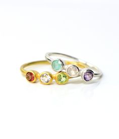 "Let us create for you a custom triple birthstone ring for you to celebrate your children. This minimalist design is great for wearing everyday and is available in sterling silver or vermeil gold. You'll love these tiny bezel set birthstones and stacking this design with other rings for a unique look. Please let me know your gemstone selection in the note to seller text box at checkout. ** Please note ** We DO NOT accept returns on these rings since these are customized with your personalization Three Stone May Birthstone Ring, Birthday Birthstone Ring With Bezel Setting, May Birthstone Stackable Ring For Birthday, Adjustable Birthstone Ring For Birthday, May Birthstone Ring With Bezel Setting For Birthday, Stackable Round Birthstone Ring For Birthday, Adjustable May Birthstone Ring, Adjustable May Birthstone Ring With Round Band, Stackable May Birthstone Ring For Birthday