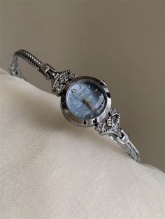 Welcome to AffordLuxe Watches! We're delighted to have you here in our store 🤩 This elegant silver toned watch features a stunning blue dial that captures the light beautifully, adding a unique pop of color to your ensemble. Delicate crystal accents embellish the intricately crafted bracelet, creating a harmonious blend of sparkle and shine.  ★Material: - Stainless Steel  - Glass - Copper  ★Dimensions: - Case Height: 6mm - Case Width: 18mm - Case Length: 18mm ★Delivery:   To ensure a smooth and Vintage Watches Women Silver, Silver Watches Women, Watch Jewelry, Watches For Women, Watches Unique, Jewelry Women, Watch Gifts, Women Wrist Watch