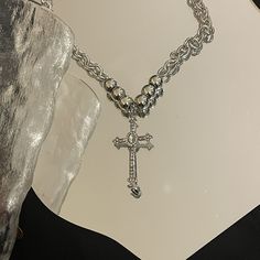 Product Details: Add more flair to your style with this elegant cross pendant necklace. This mock diamond pendant necklace features an elegant design with devotional symbolism. Add this beauty to your collection for a dramatic appeal. Style: Fashion，Trendy Quantity: 1 pcs Material: Alloy, Rhinestones Length：Necklace length 48.5cm, extension chain 8.4cm, cross length 5.6cm Metal Cross Pendant Necklace, Spiritual Metal Cross Necklace, Elegant Metal Crucifix Cross Necklace, Metal Cross Necklace With Clavicle Chain, Metal Cross Necklace, Baroque Jewelry, Necklace With Cross, Cross Charm Necklace, Goth Necklace