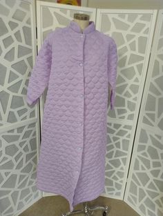 This pretty mauve dressing gown robe is from the 1970s and presents in good condition too. The gown has a Cuban collar and a full button front, has one side seam pocket and is below knee length. Measurements are  Shoulder to shoulder 44cm Bust 122cm Sleeves shoulder to cuff 49cm Length shoulder to hem 122cm Quilt Dress, Dressing Gown Robe, Pajama Robe, Womens Robes, Dressing Gown, Shoulder Sleeve, Medium Size, Gowns Dresses, Knee Length