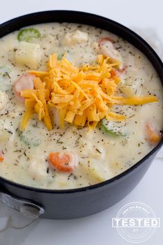 a close up of a bowl of soup with cheese