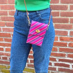 Perfect for when you need a small bag for a day out, meet the Roxanne Crossbody Bag! This bargello cutie is just right for holding your phone and a few essentials, keeping them secure with colorful style. Designed to be wearable from season to season, this bag looks equally great with a summer dress or a jean jacket. It's fun to stitch with clever construction, and chic gold hardware for a truly elevated look. The Roxanne Crossbody comes in two vibrant colorways and each kit includes all the sup Trendy Mobile Phone Bag Pouch For Everyday Use, Trendy Mobile Phone Pouch For Everyday Use, Trendy Multicolor Portable Phone Bag, Trendy Multicolor Phone Bag For Daily Use, Trendy Purple Phone Bag For Daily Use, Trendy Portable Multicolor Phone Bag, Casual Pink Phone Bag, Everyday Pink Bag With Cell Phone Pocket, Pink Shoulder Bag With Mobile Phone Pocket For On-the-go