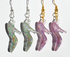 "Introducing my enchanting Holographic High Heel Shoe Earrings, the perfect accessory to add a touch of whimsy to your collection. Inspired by fairy tales, these earrings evoke a sense of magic and elegance. A stunning holographic high heel design, which catches the light from every angle.  Available in a choice of two colors, Silver or Pink. Notice the difference in how they look in sunlight  Total length of earring is approx 2 3/8\" Nickle free Silvertone Or Goldtone wires Comes in an Organza bag-ready for gifting" Cute Iridescent Jewelry For Parties, Fairy Style Dangle Earrings For Parties, Cute Iridescent Earrings For Gift, Handmade Fairy Earrings For Party, Fairytale Earrings, Shoe Earrings, Designer High Heels, Princess Coloring, Heel Design