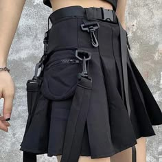 Introducing the Techwear Skirt. This stylish and versatile skirt is perfect for everyday wear or dressing up for a night out. Made from a durable black fabric, it features multiple pockets for holding your essentials, and a high-waisted design that flatters your figure. Whether you're pairing it with a cute top and sneakers or rocking it with a leather jacket and boots, this skirt will make you look and feel your best. So don't miss out, order your Techwear Skirt today! Tech Wear Women, Techwear Skirt, Techwear Women, Goth Skirt, Techwear Outfits, Lace Up Tank Top, Cyberpunk Fashion, Prom Dress Inspiration, Skirt With Pockets