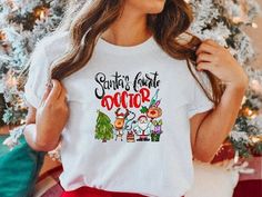 "Santa's Favorite Doctor 🎄 Get ready for the holidays in one of our adorable medical tees or sweatshirts! Makes for a wonderful gift for the doctor in your life! Shop MORE Christmas Shirts/Sweatshirts here: https://etsy.me/2FrfJqO * * * * * * * * * * * * * * * * * * * * * * * * * * * * * ♥️ LISTING 1 - Santa's Favorite Doctor Shirt or Sweatshirt HOW TO ORDER: * Choose size. (Unisex T-Shirt or Crewneck Sweatshirt) * Select Color if available. * Enter personalization if needed. * Add to cart. * S Art Krishna, Xray Tech, Staff Gifts, European Hair, Hair Strands, Womens Graphic Tees, School Tees, Tech Shirt, Holiday Sweatshirt