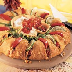 a platter filled with lots of food on top of a table