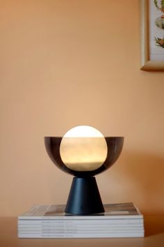 a table lamp sitting on top of a book