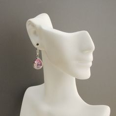 "Sparkling pink earrings. Rhodium plated pink glass teardrops with rope trim. The glass drop earrings measure 1 1/4\" long and the ear wires are sterling silver. A dazzling shade of cotton candy pink. Perfect for your bridesmaid gift. * rhodium plated teardrop (13 x 10mm) * sterling silver ear wires The earrings will arrive gift boxed. The matching necklace, as shown in picture #5, is available in my shop at: https://www.etsy.com/listing/193511812/light-pink-necklace-pink-bridesmaid?ref=shop_hom Nickel Free Teardrop Earrings For Wedding, Hypoallergenic Teardrop Crystal Earrings For Party, Hypoallergenic Teardrop Crystal Earrings For Formal Occasions, Single Pink Earring For Anniversary, Pink Pierced Jewelry For Formal Occasions, Pink Single Earring For Anniversary, Sterling Silver Nickel Free Teardrop Earrings For Wedding, Pink Drop Earrings For Anniversary, Pink Hypoallergenic Earrings For Formal Occasions