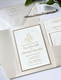 the wedding stationery is laid out on top of each other, including a pen and envelope