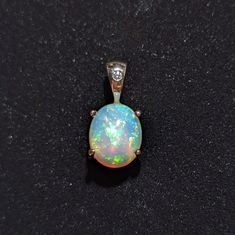 Delightful Ethiopian Opal set in genuine 14k Yellow Gold with a diamond accented bail. Luxury Gold Jewelry With Ethiopian Opal, Luxury Ethiopian Opal Fine Jewelry, Tacoma Wa, Opal Pendants, Pendant Set, Ethiopian Opal, Pendant Necklaces, Jewelry Necklace Pendant, Opal