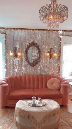 a living room filled with furniture and a chandelier