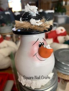 a snowman made out of an old jar