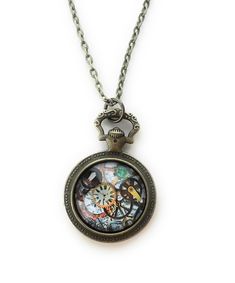 Love steampunk? This charming vintage pocket watch style pendant necklace is a perfect fit! The center image is made up of an array of gears and clocks. The gear image is printed on photo paper and set under a glass cabochon. The glass cabochon is set in an antique brass alloy tray in the shape of an antique pocket watch with matching 24 -inch chain.  The back side of the pendant has a wonderful decorative look so if your necklace gets turned around, it still looks great! The pendant itself meas Silk Cord Necklace, Antique Pocket Watch, Mandala Necklace, Steam Punk Jewelry, Pocket Watch Antique, Vintage Pocket Watch, Horse Necklace, Compass Necklace, Steampunk Necklace