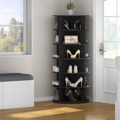 there is a black shelf with shoes on it