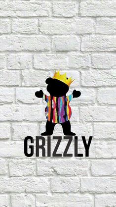 the grizzlyy logo on a brick wall is painted in black and white with colorful stripes