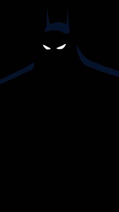 an image of a batman silhouette in the dark