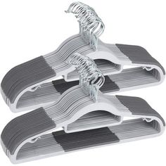 three gray and white clothes hangers on a white background with clippings attached to them