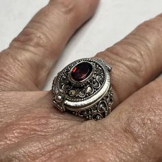 This Elegant Poison Ring Is Made Of High-Quality Sterling Silver And Features A Beautiful Garnet Stone. The Ring Is A Size 9 And Has A Unique Pillbox Style. It Is Perfect For Those Who Want A Stylish And Functional Accessory. The Ring Does Not Have Any Diamonds Or Other Gemstones, Making It A Great Choice For Those Who Prefer A Simple And Classic Design. The Metal Purity Is 925 And The Base Metal Is Also Silver. This Ring Is A Great Addition To Any Jewelry Collection And Is Sure To Impress. Victorian Widow, Maximalist Rings, Poesy Rings, Emo Oc, Pirate Bar, Victoria Era, Season Outfits, Garnet Color, Poison Ring