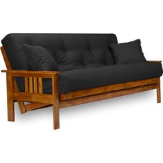 a wooden futon with black pillows on it's back and arms, in front of a white background