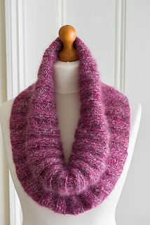 a purple knitted cowl on a mannequin