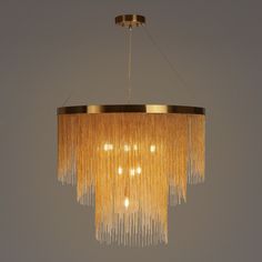 a chandelier with several lights hanging from it's sides in a room