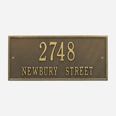 an address plaque with the words newbury street engraved on it