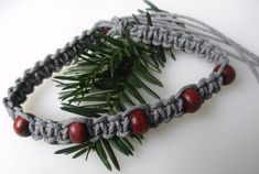 This thicker grey hemp design is created using a square knot embellished with dark brown wooden beads and finished with a wooden bead and double loop closure. 3/5 Hemp Jewelry, Hemp Necklace, Square Knot, Cute Bracelets, Choker Necklaces, Matching Bracelets, Wooden Beads, Mens Bracelet, Diy Jewelry