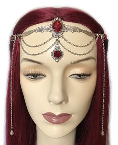 "This gothic vampire inspired headpiece is made with a large antiqued silver plated bat, filigree beads, findings and draping chains. It is accented with sparkling DARK RUBY RED glass rhinestones/jewels. Centerpiece is worn with silver plated cable chain. Decorated portion is 6 3/4\" wide and 2 1/2\" tall in the center. Side hanging strands are 6 1/2\" in length. Headpiece is adjustable 21-24\" with a lobster clasp and chain extender in the back. If you would like a different length or stone col Silver Gothic Costume Accessories For Cosplay, Silver Costume Accessories For Halloween Fantasy Events, Silver Fantasy Headpiece For Costume Party, Silver Fantasy Costume Accessories For Fantasy Events, Adjustable Gothic Costume Accessories For Fantasy Events, Gothic Silver Jewelry For Costume Party, Silver Gothic Costume Accessories For Costume Party, Silver Costume Accessories For Halloween, Gothic Festival Headpiece